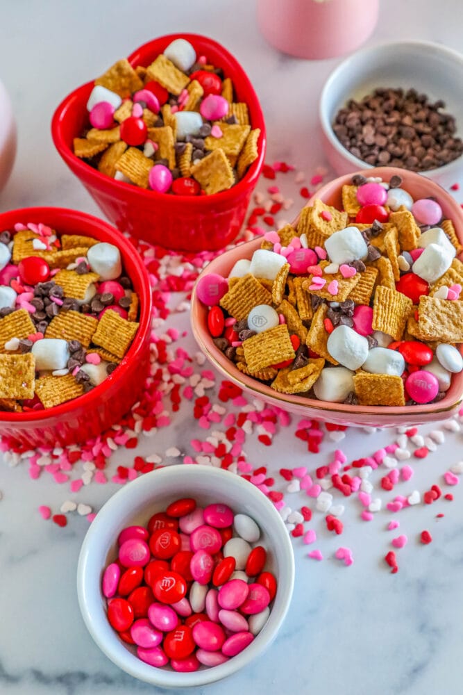 cereal, marshmallows, pink M&Ms, and chocolate chips in a bowl