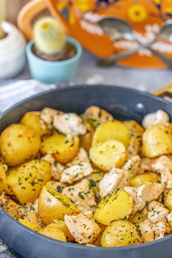 lemon garlic chicken and potatoes in a pan