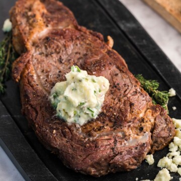 picture of new york strip steak with blue cheese butter on top