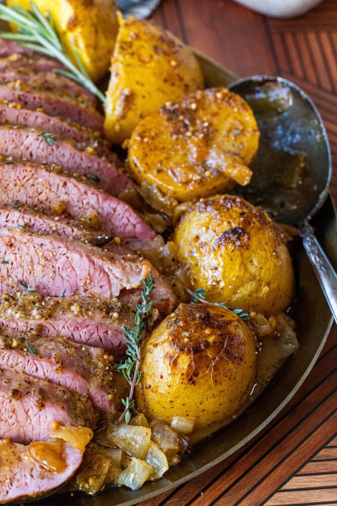 picture of corned beef on a platter with potatoes