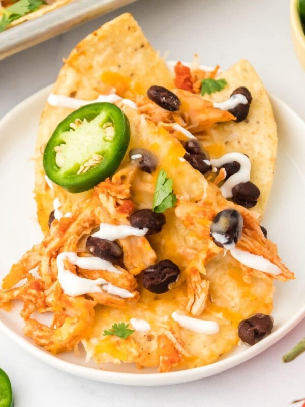 picture of instant pot chicken nachos on a white plate