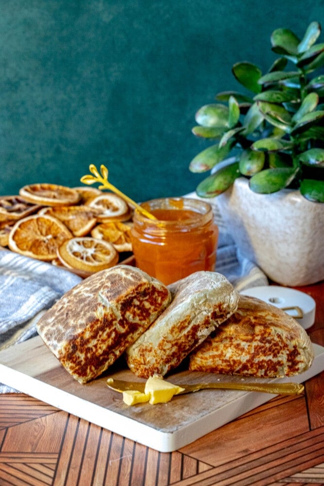 picture of irish potato bread on a cutting board with butter