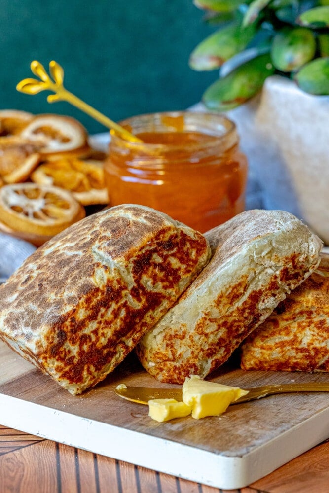 picture of irish potato bread on a cutting board with butter