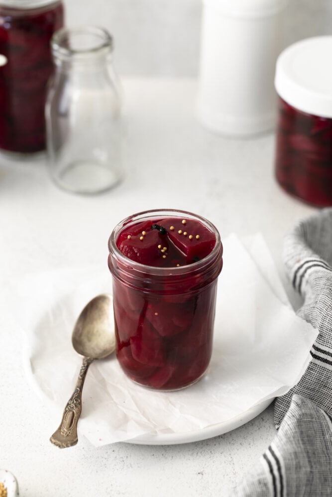 picture of pickled beets in a jar with a spoon
