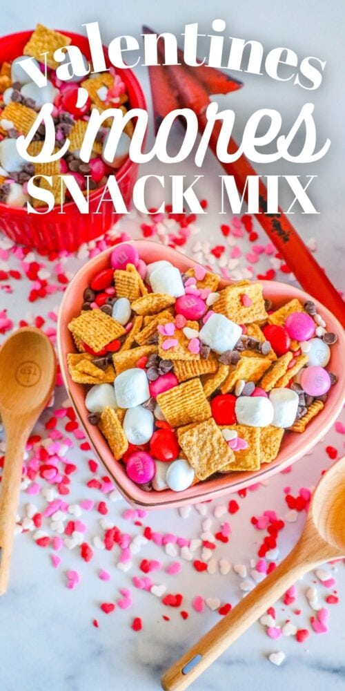 cereal, marshmallows, pink M&Ms, and chocolate chips in a bowl. Valentines Smores Snack Mix written across it