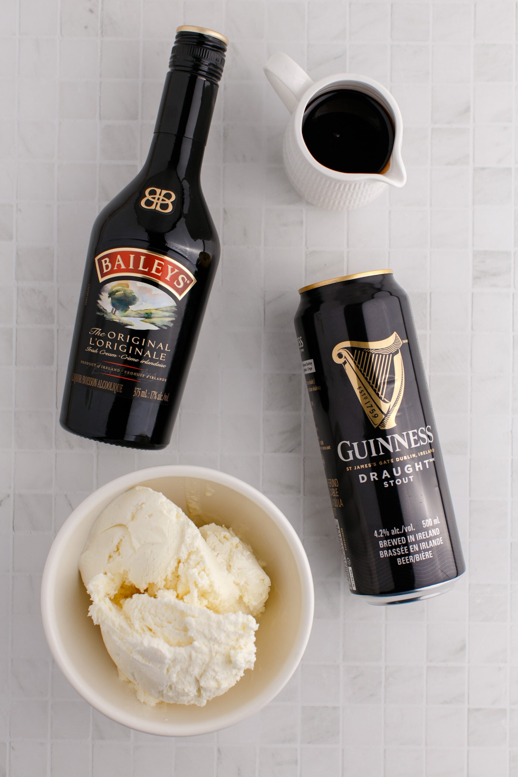 baileys, guinness, ice cream, and chocolate syrup on a table