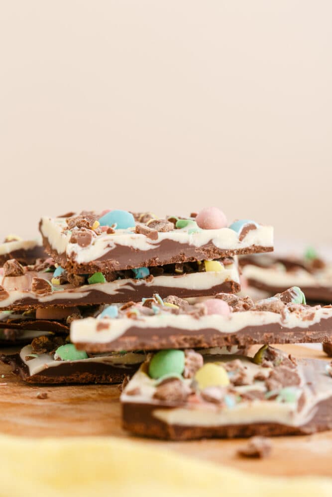 stack of white and dark chocolate bark with m&ms in it