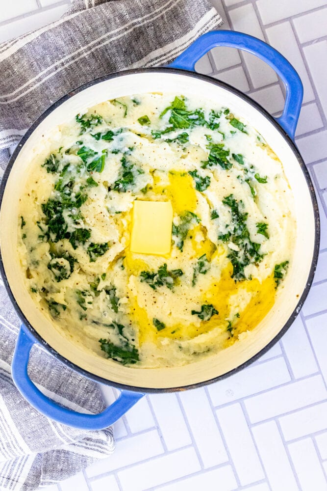 picture of mashed potato and kale irish colcannon in a blue dutch oven