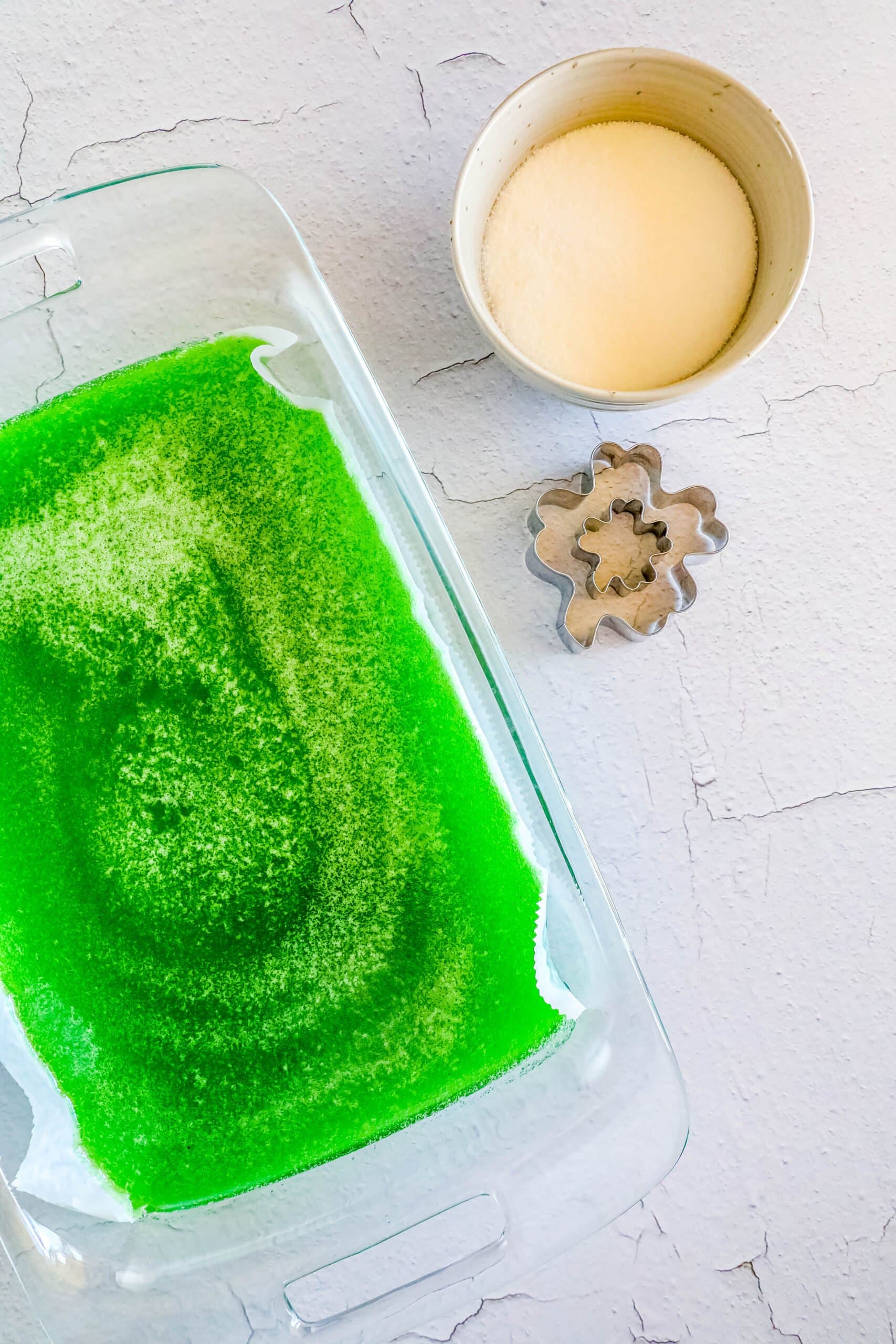 picture of gelatin, sugar, and shamrock cookie cutter on a table