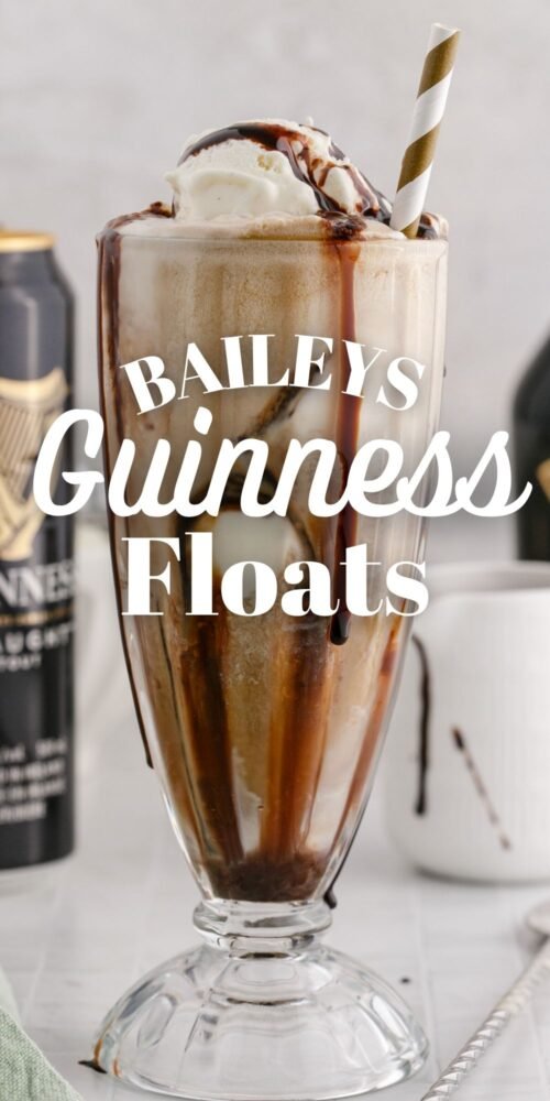 guinness float in a a glass with a gold paper straw in it and chocolate syrup in the glass