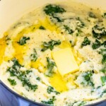 mashed potato and kale irish colcannon in a blue dutch oven
