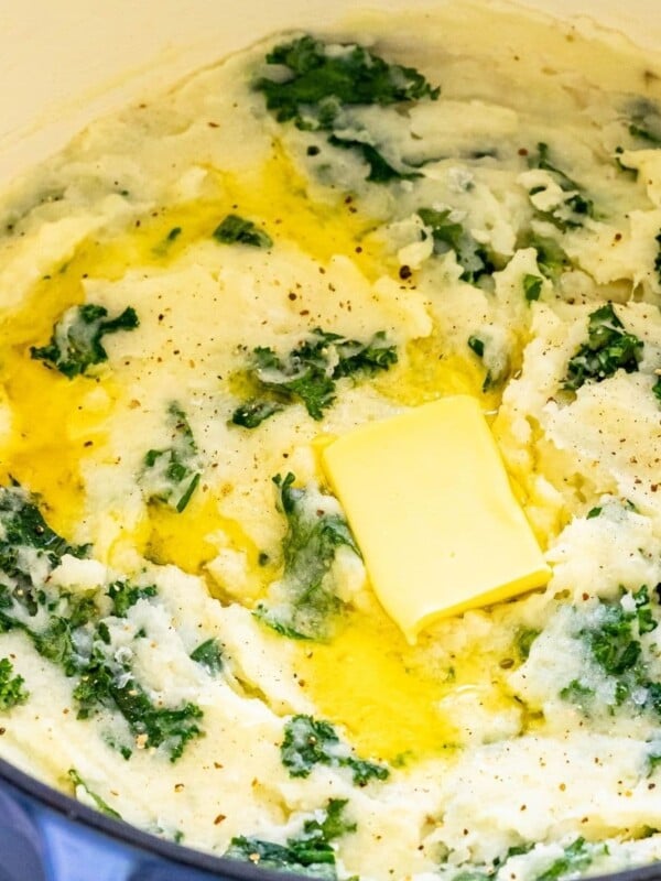 mashed potato and kale irish colcannon in a blue dutch oven