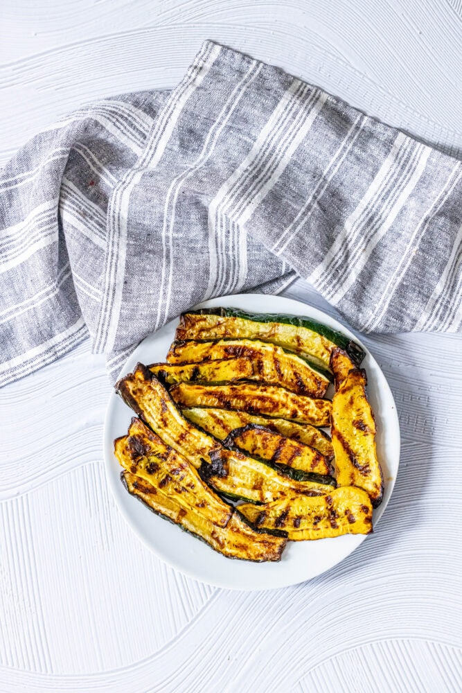 picture of grilled zucchini and squash on a white plate