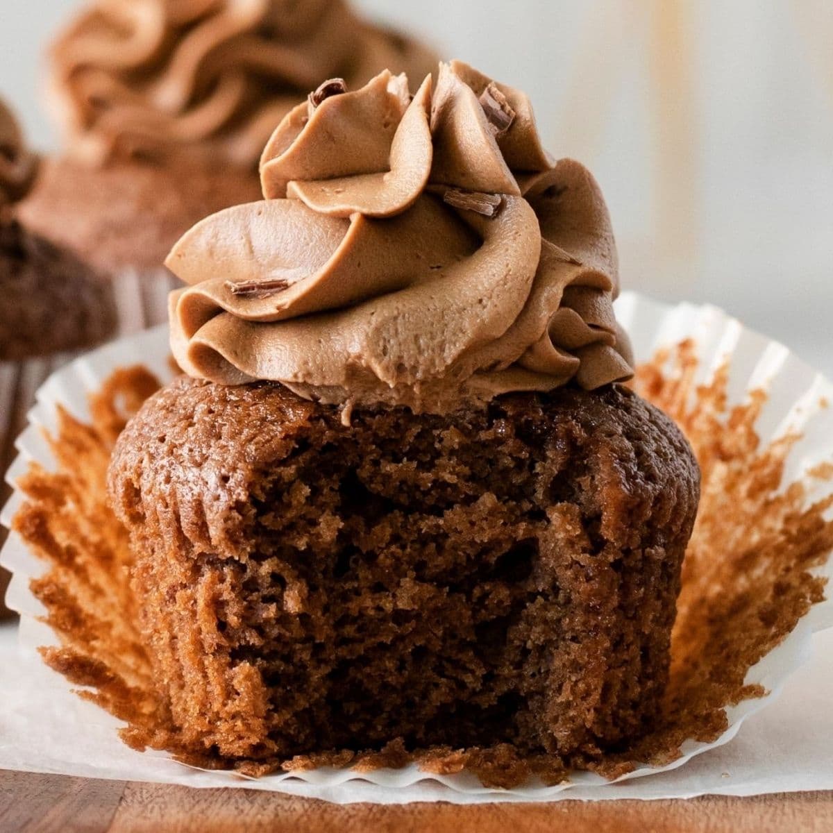 picture of a guinness chocolate cupcake in a paper wrapper on a cutting board