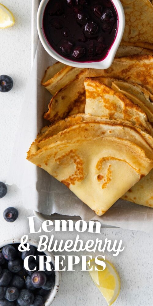 picture of lemon blueberry crepes on a dish with blueberry sauce