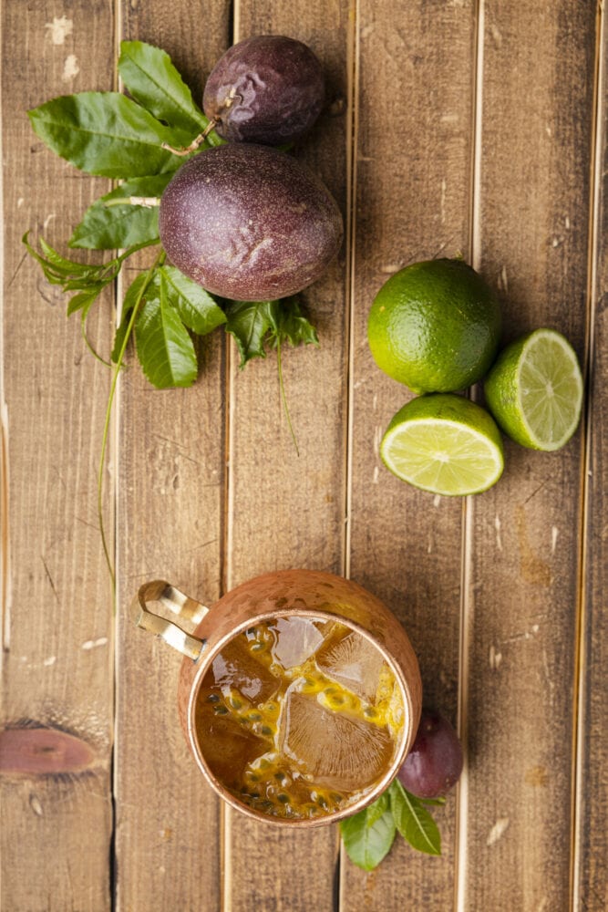 picture of passion fruit dark and stormy in a copper mug