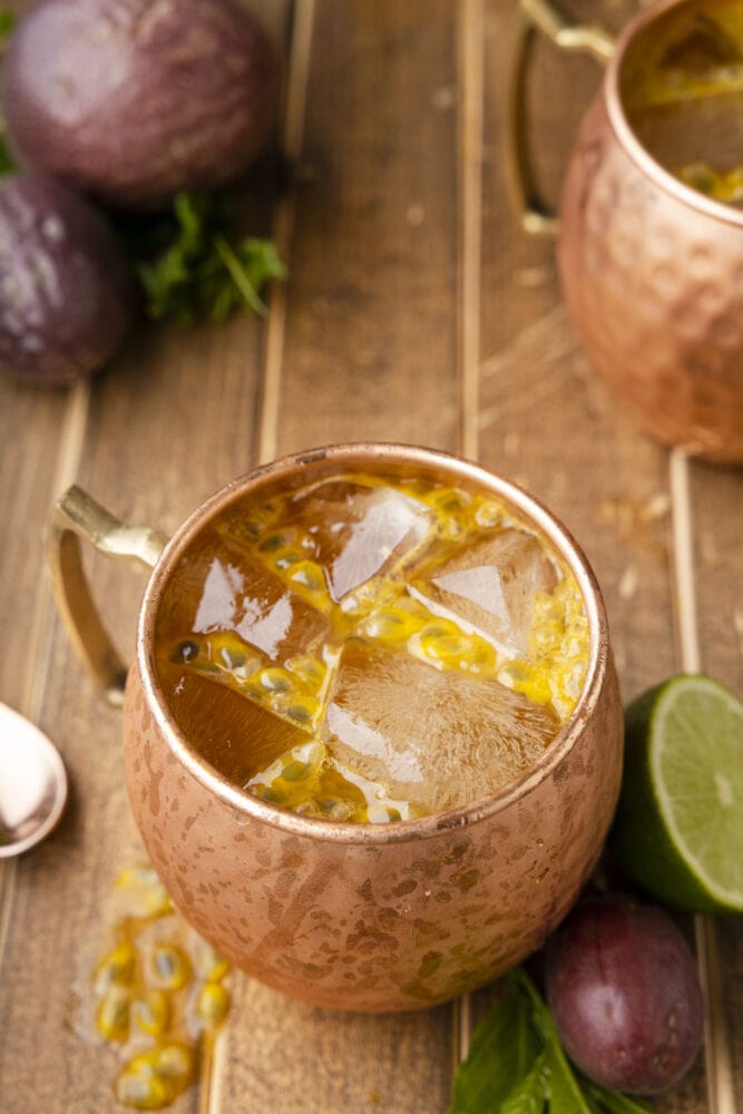 picture of passion fruit dark and stormy in a copper mug