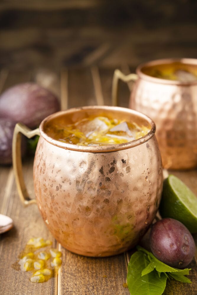 picture of passion fruit dark and stormy in a copper mug