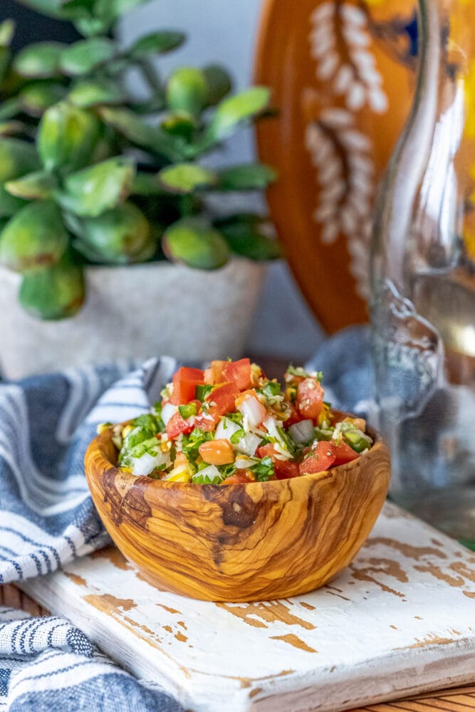 picture of corn pico de gallo in a wooden bowl 