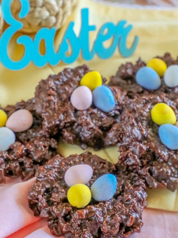 picture of chocolate cookies shaped like a birds nest with candy eggs on top