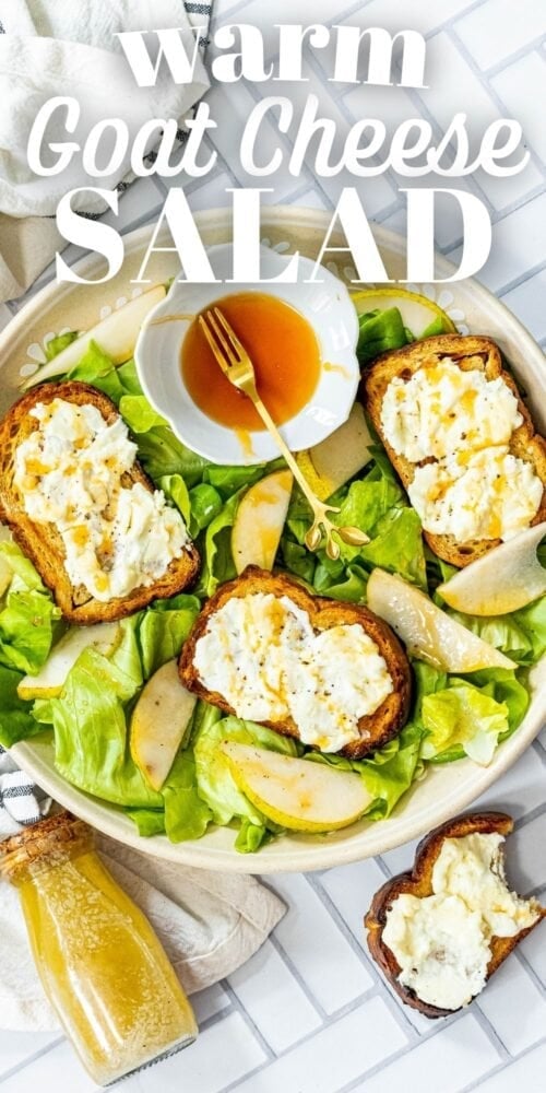 picture of butter lettuce salad in a bowl topped with bread with goat cheese, honey, pears, and champagne vinaigrette dressing