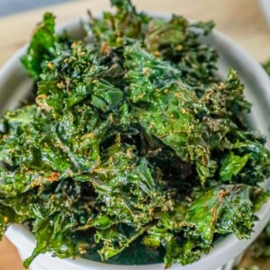 picture of baked kale chips in a white bowl