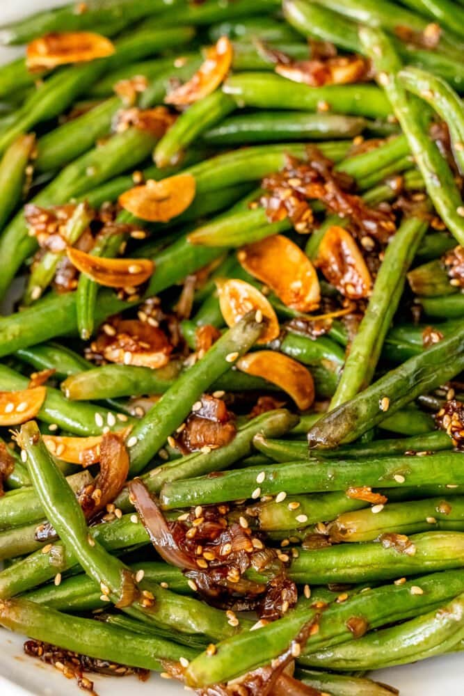 picture of chinese garlic green beans in a white bowl on a table