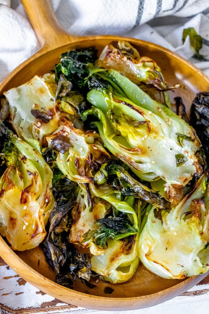 picture of grilled bok choy on a plate on a table 