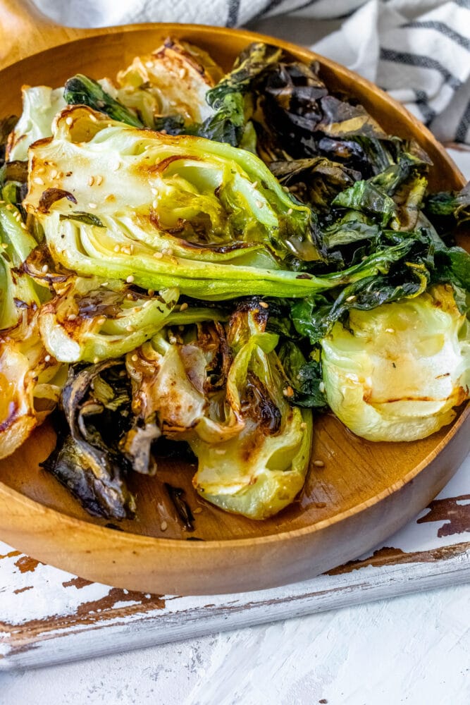 picture of grilled bok choy on a wood platter