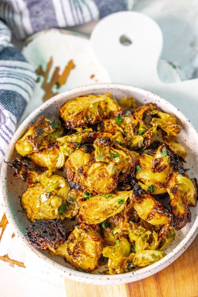 picture of caramelized ranch brussels sprouts in a white bowl 
