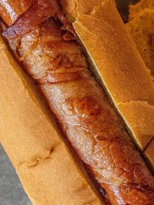 picture of bacon-wrapped hot dog in a hot dog bun