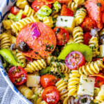 Antipasti pasta salad with pepperoni, tomatoes and olives.