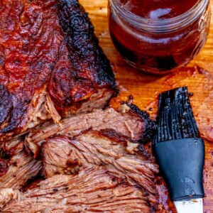 picture of smoked brisket on a wooden cutting board