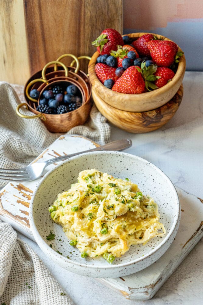 picture of baked chicken tetrazzini noodle casserole with peas on a plate