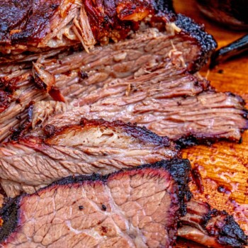 picture of smoked brisket on a wooden cutting board