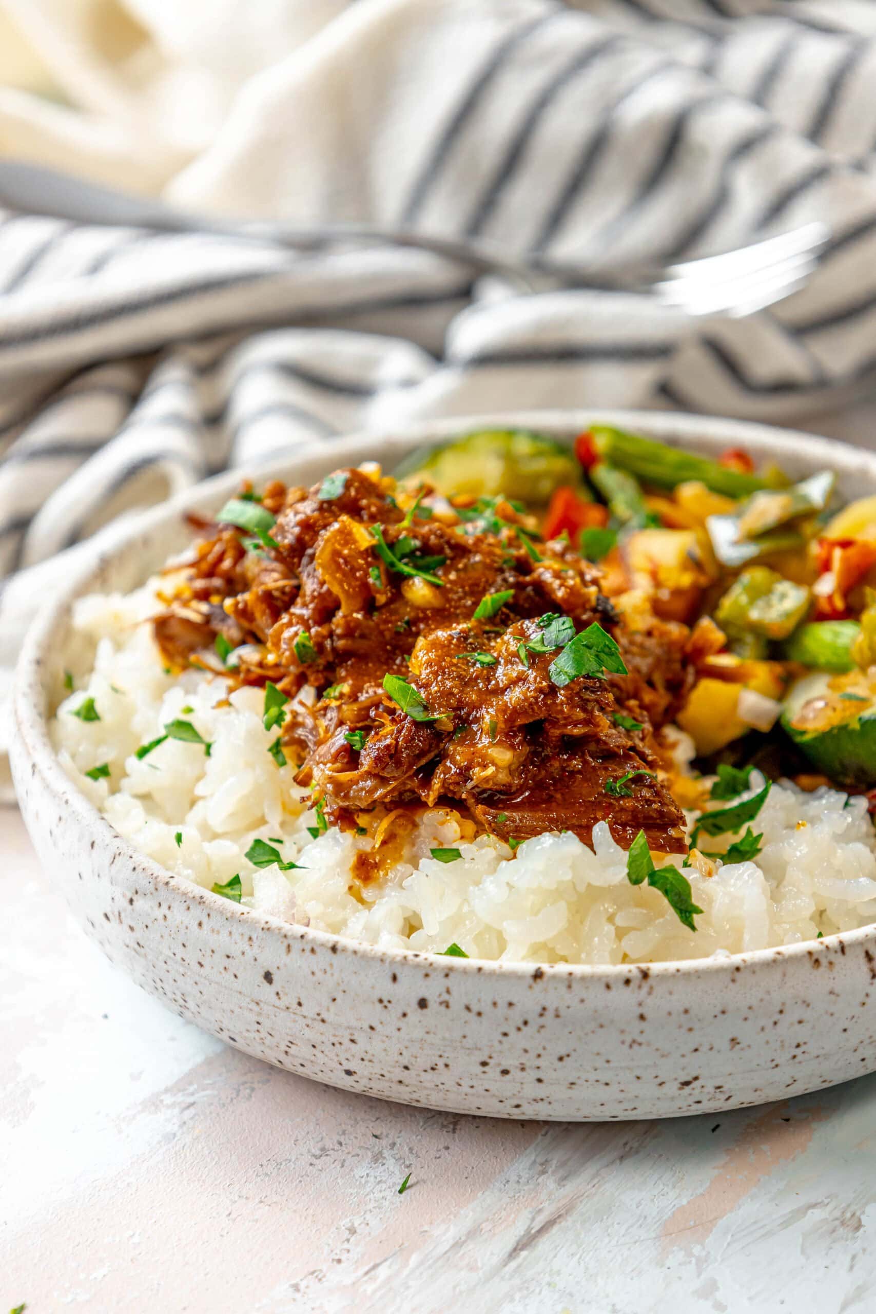 A bowl of rice with beef and vegetables in it, prepared with Instant Pot.