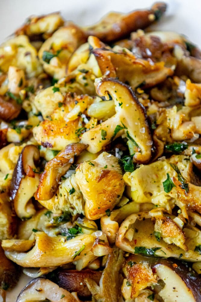 picture of sauteed mushrooms in a white bowl