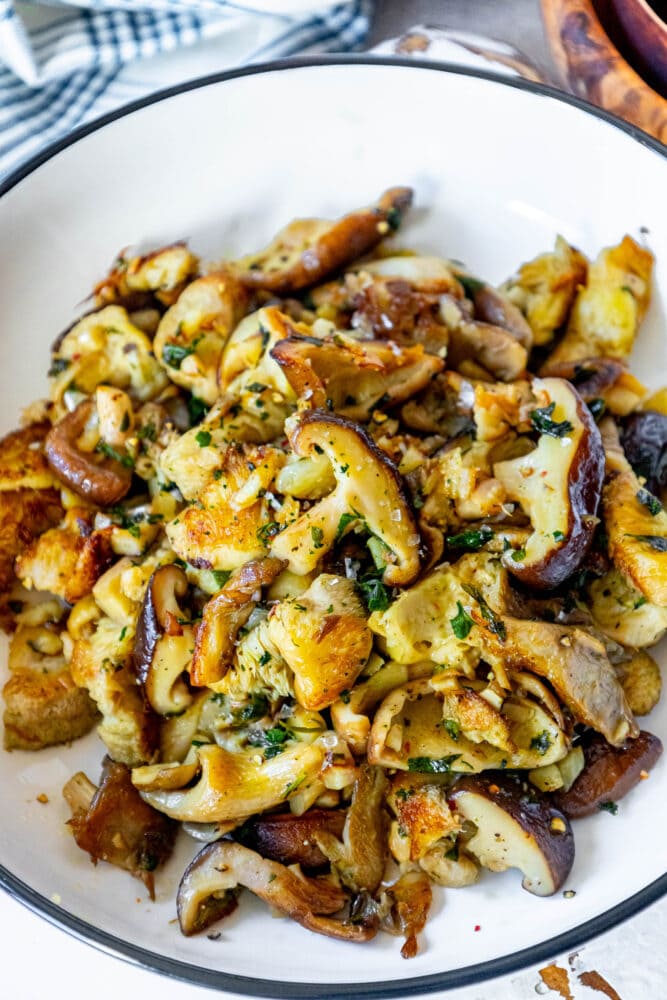 picture of sauteed mushrooms in a white bowl