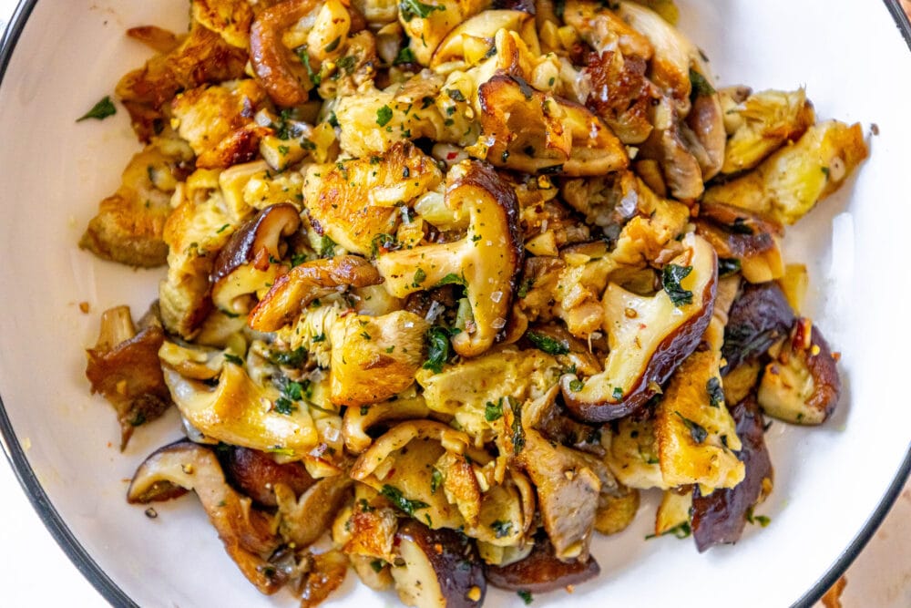 picture of sauteed mushrooms in a white bowl