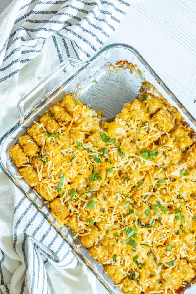 picture of tater tot cowboy casserole in a glass baking dish