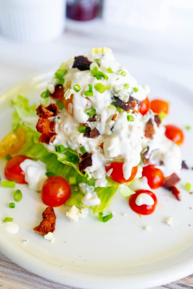 salad with green onions, tomatoes, bacon, and crumbled blue cheese dressing