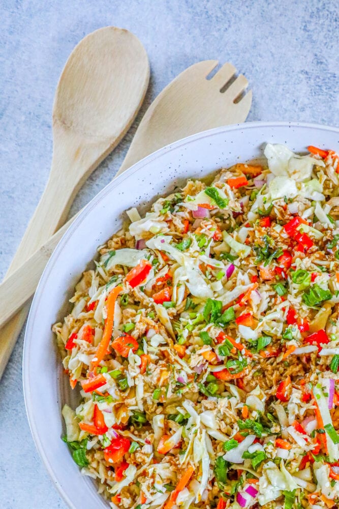 picture of Thai chicken salad in a white bowl on a table 