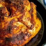 picture of beer can chicken in a cast iron pan