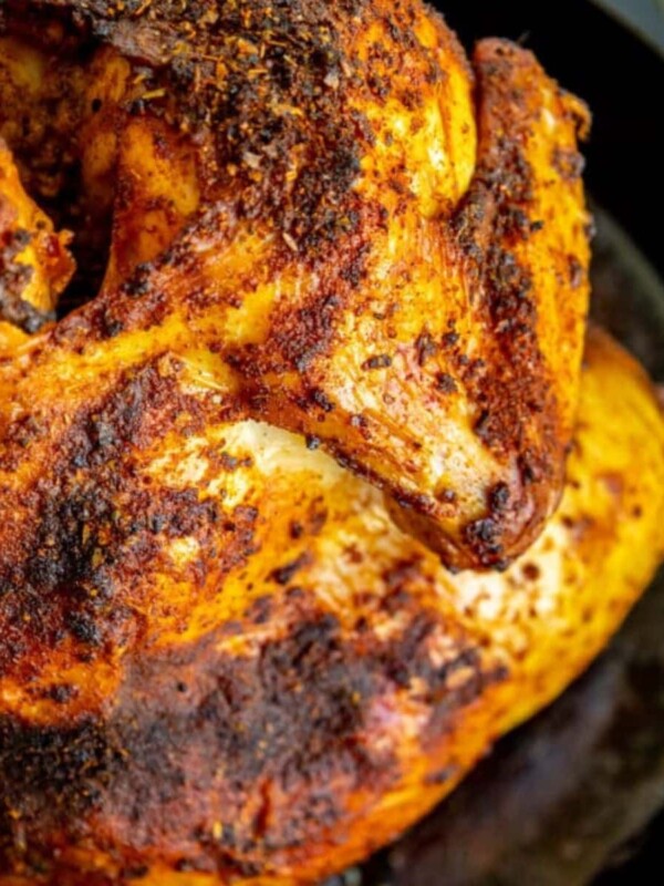 picture of beer can chicken in a cast iron pan