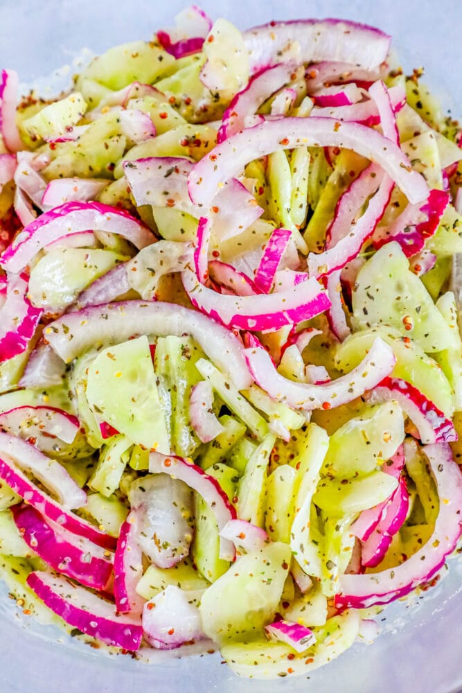 picture of creamy cucumber salad with onion and mustard in a bowl 