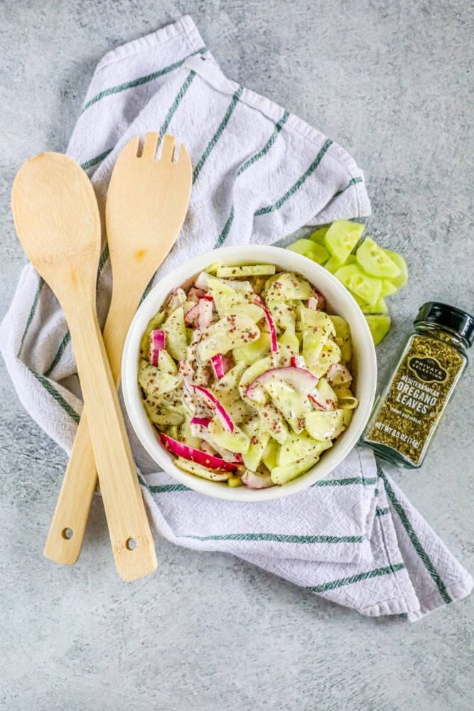 picture of creamy cucumber salad with onion and mustard in a bowl 