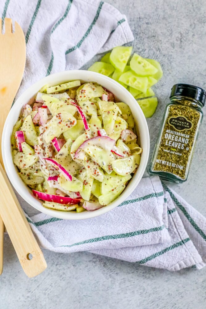picture of creamy cucumber salad with onion and mustard in a bowl 