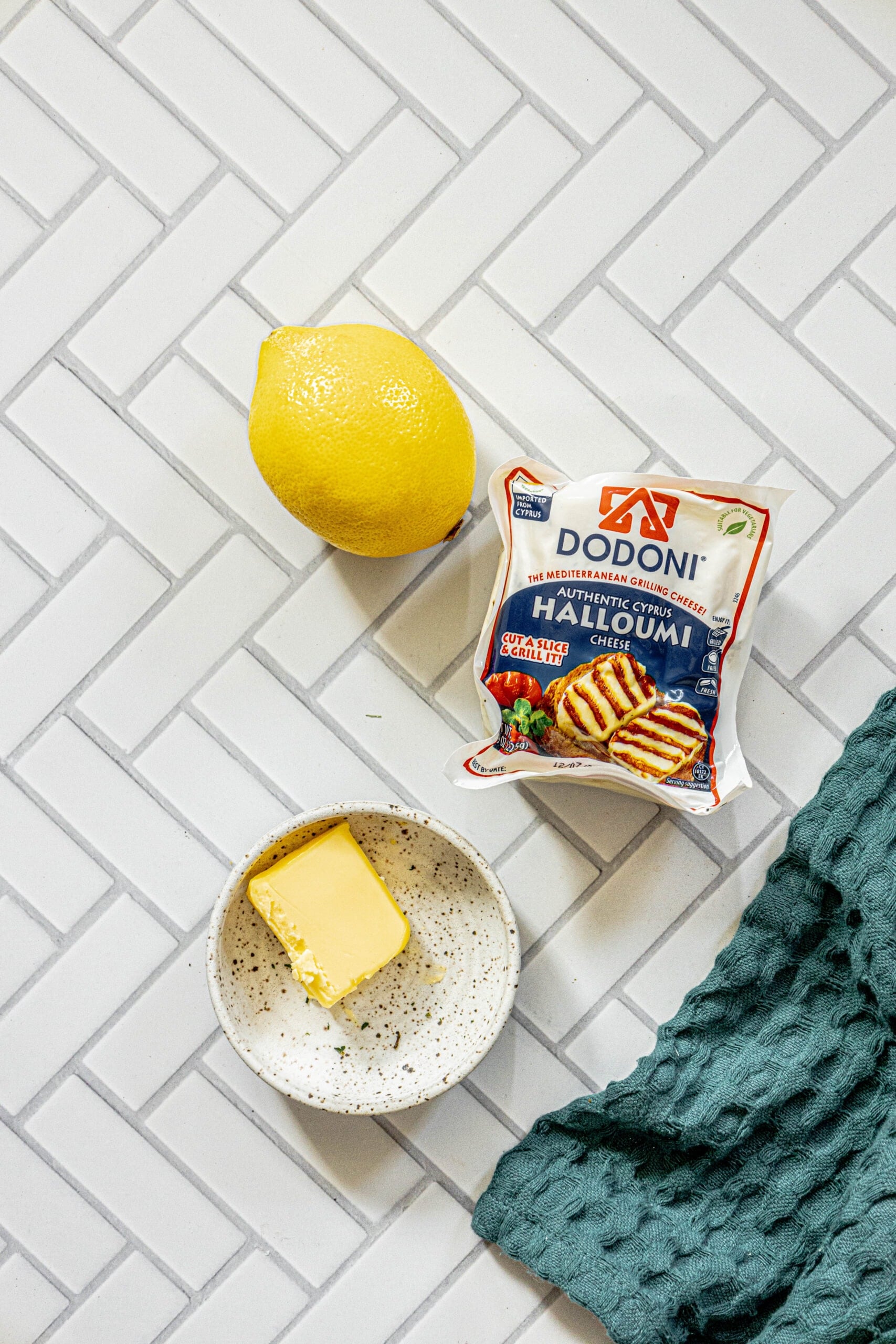 picture of lemon, halloumi, and butter on a table