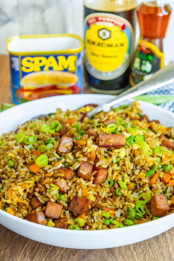 picture of spam fried rice with peppers, peas, and chopped green onions a bowl