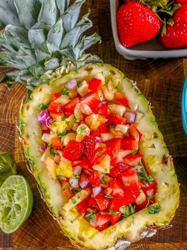 picture of strawberry pineapple salsa in a hollowed out pineapple